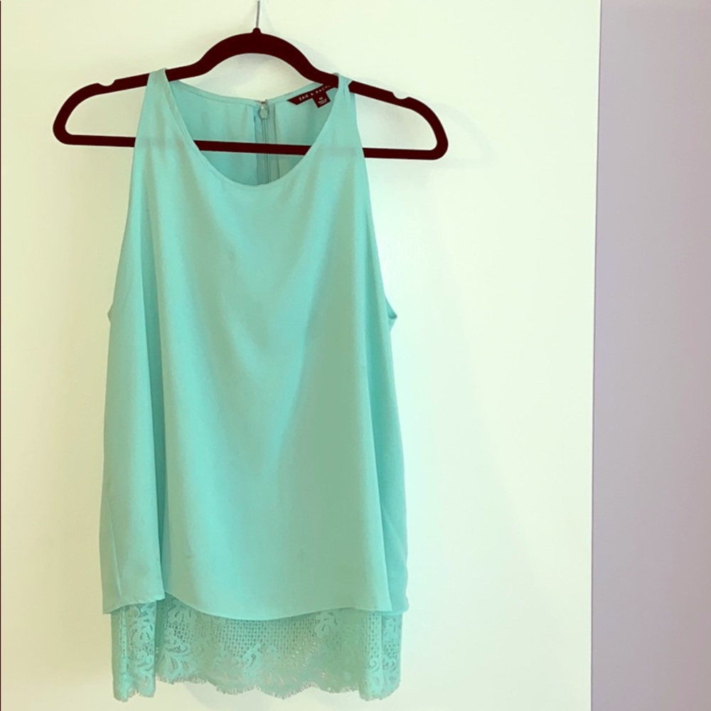 Sleeveless top with lace bottom